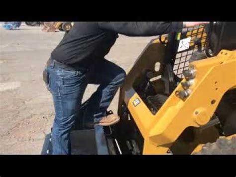 show how to disconnect a skid steer bucket|cat skid steer bucket removal.